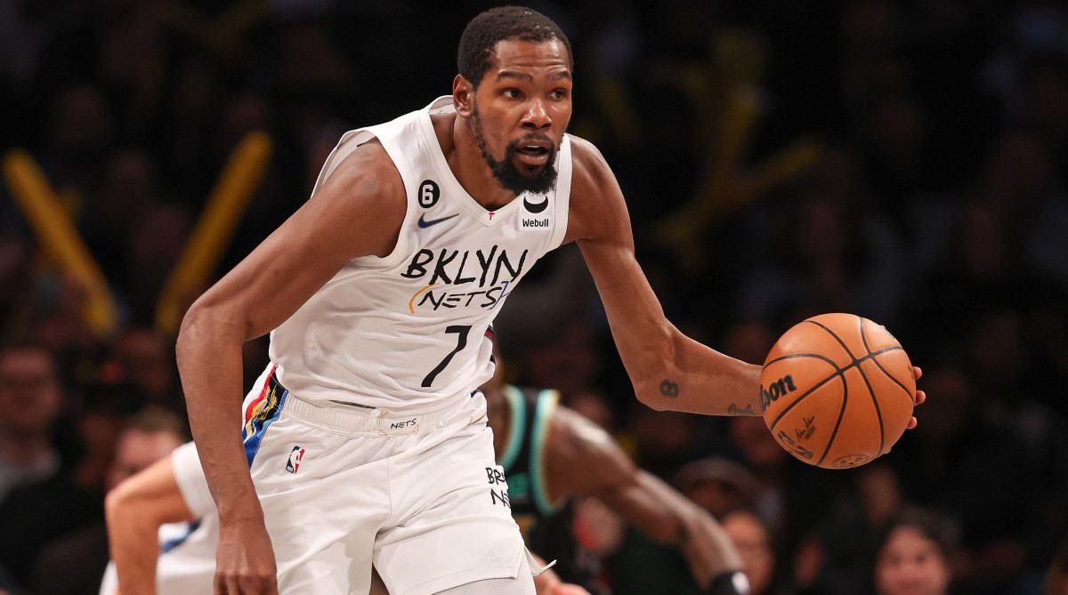 Nets forward Kevin Durant dribbles up court during the second half against the Charlotte Hornets.
